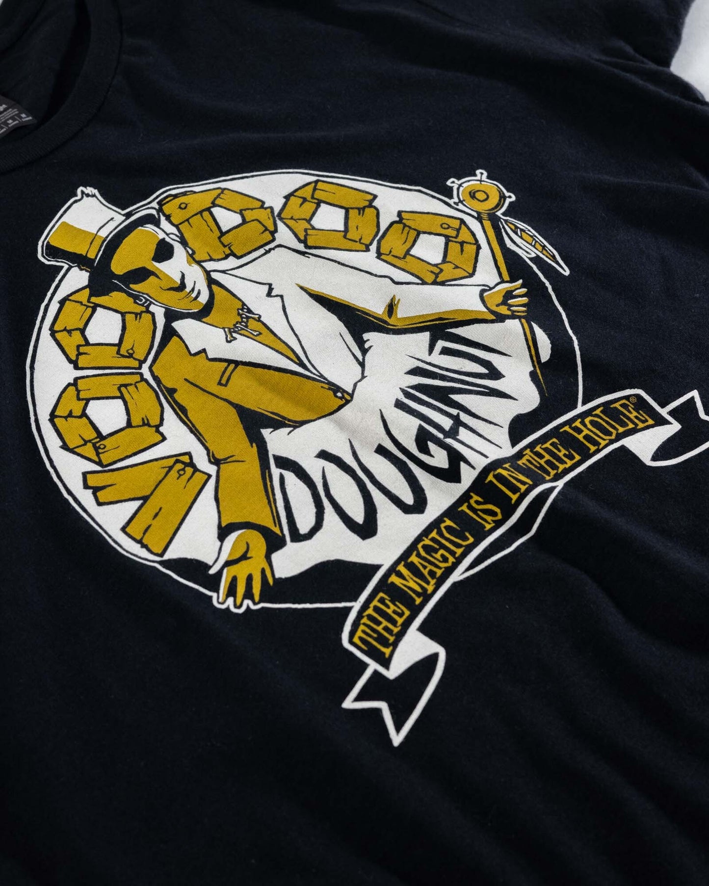 black t-shirt "Voodoo Doughnut" "The Magic is in the Hole"