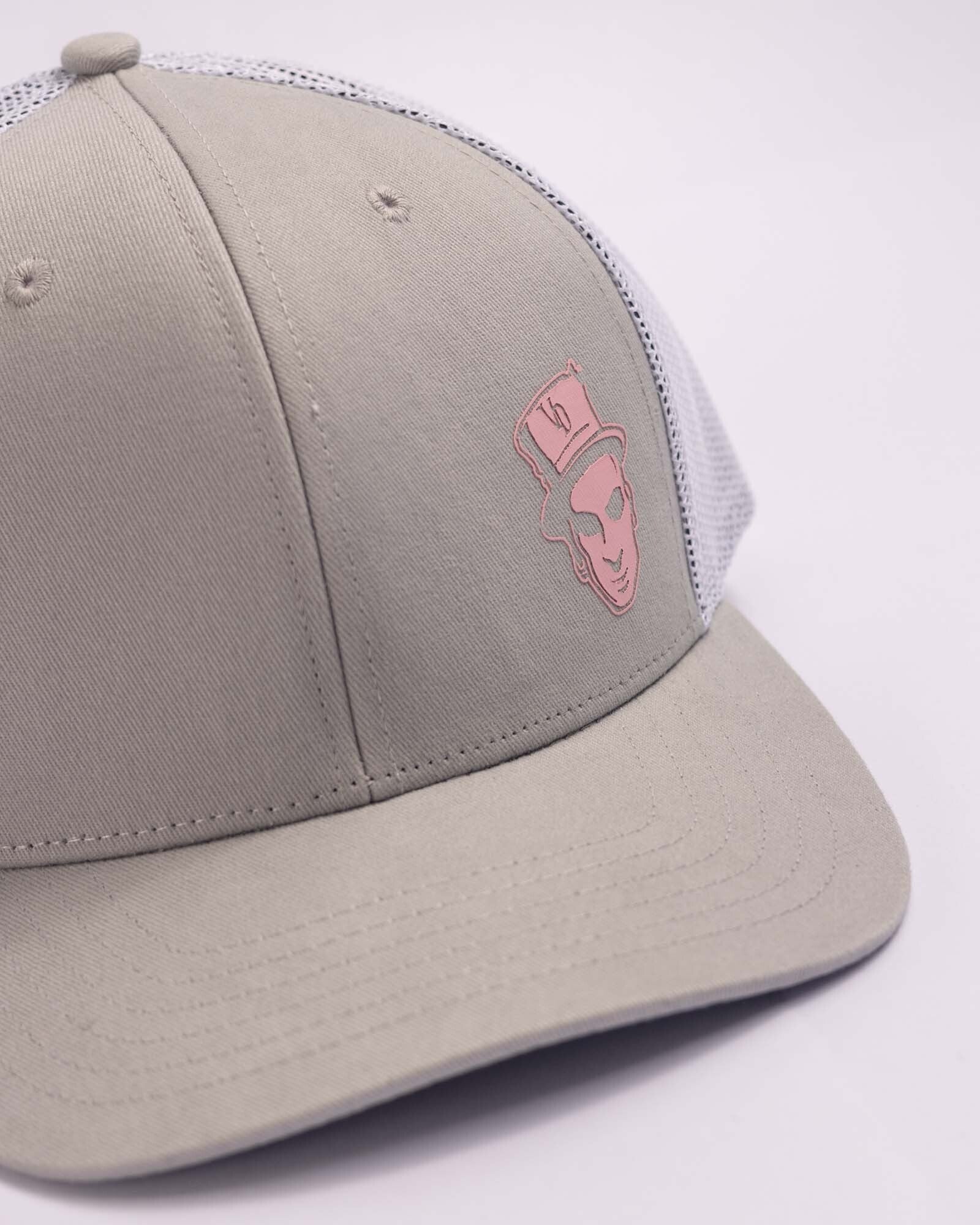 grey trucker cap with voodoo baron featured on left front panel