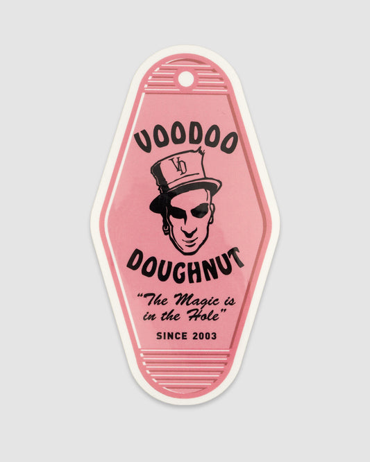 Pink Voodoo Doughnut sticker on a light gray background