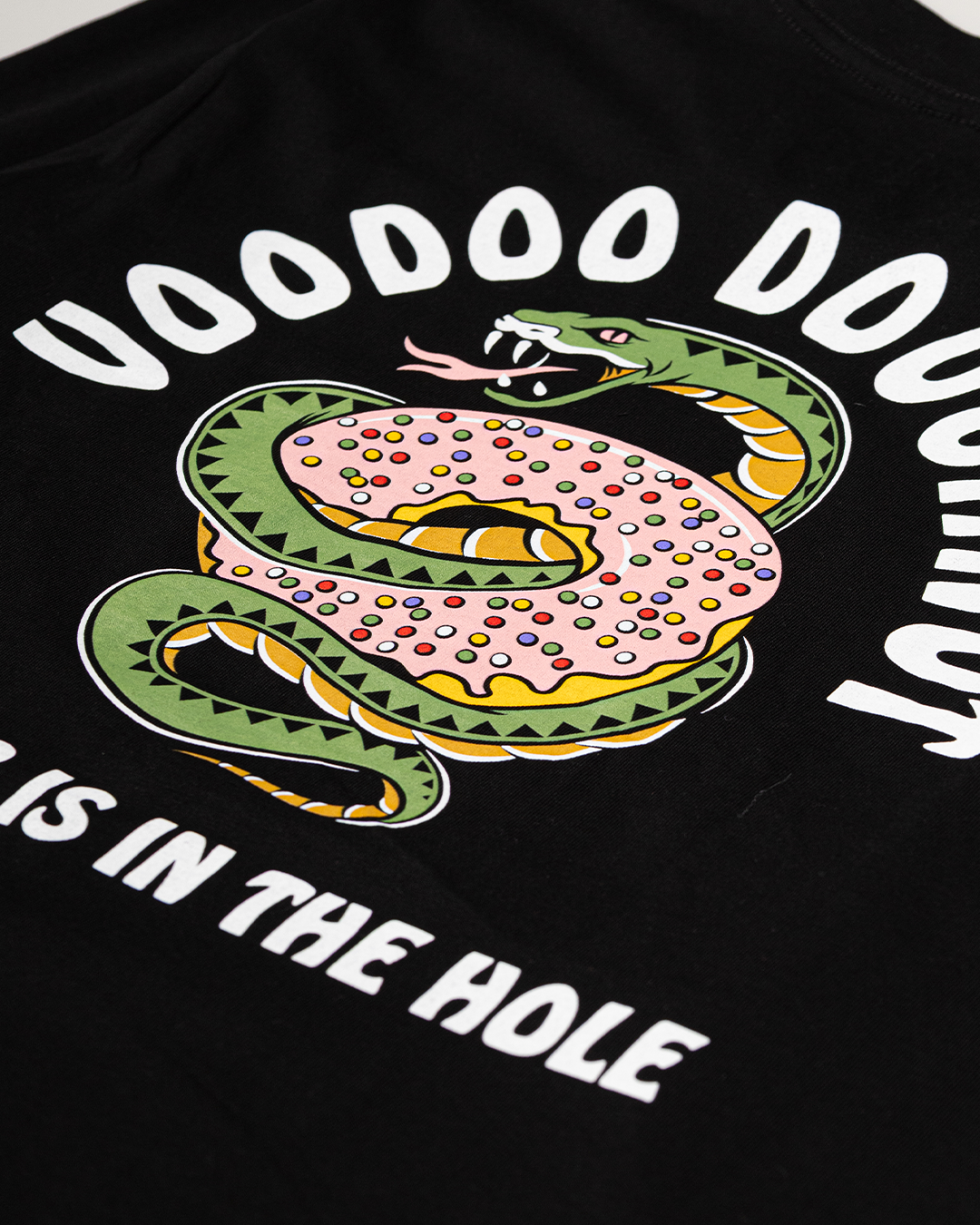 Black t-shirt with a green snake design