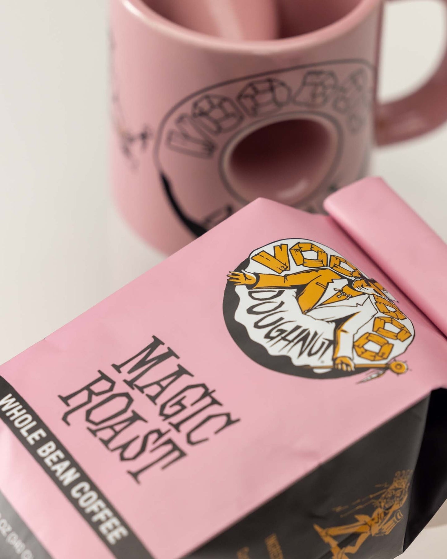 https://voodoodoughnutshop.com/cdn/shop/files/VooDoo-Doughnuts-magic-roast-coffee-005.jpg?v=1691677273&width=1445