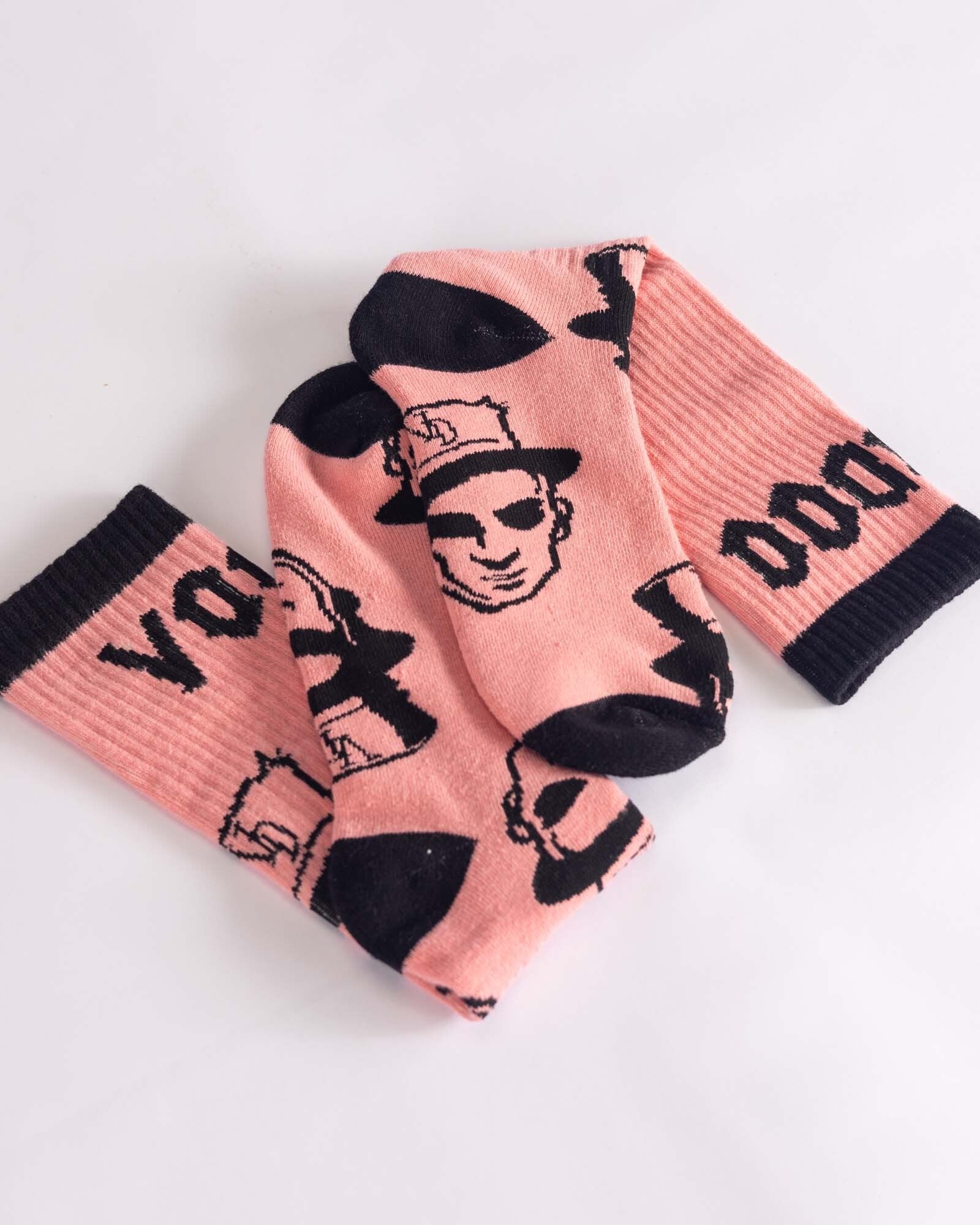 pink voodoo socks with black graphics
